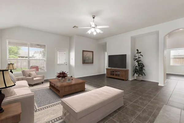a living room with furniture and a flat screen tv