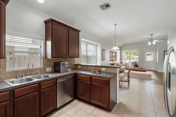 a kitchen with a sink counter top space and appliances