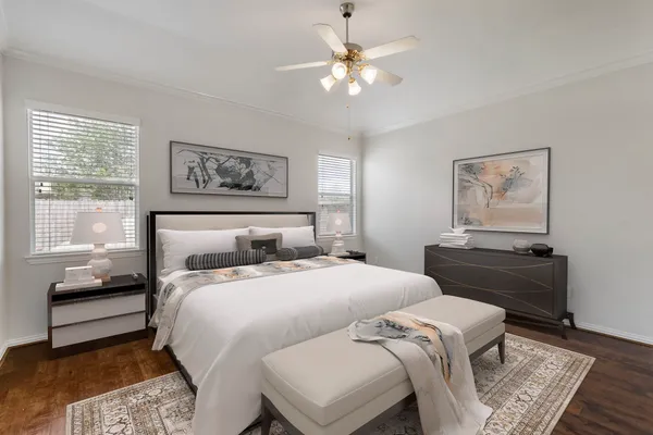a bedroom with a bed and a couch