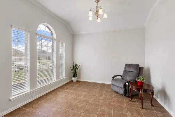 a view of room with workspace and windows