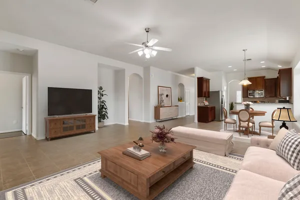 a living room with furniture and a flat screen tv