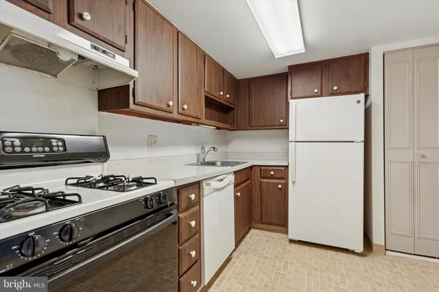 a view of a room with a sink and cabinet