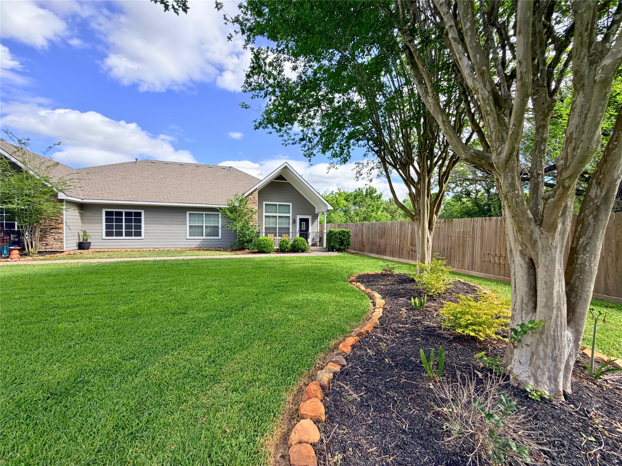 312 Hunt Road, Unit 312 Baytown, TX 77521 - Photo 1 of 28 a front view of a house with garden