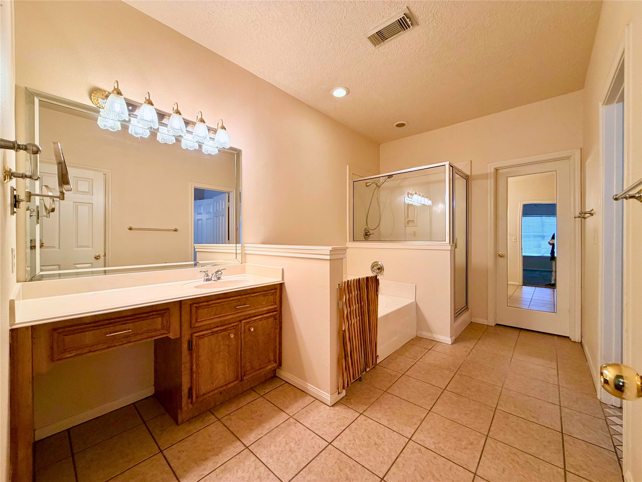 312 Hunt Road, Unit 312 Baytown, TX 77521 - Photo 23 of 28 a spacious bathroom with a double vanity sink and a mirror