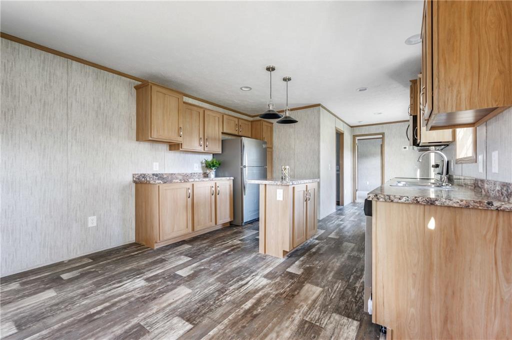 69 South Summit Road, Unit 102 Greenville, PA 16125 - Photo 6 of 24 a kitchen with refrigerator and cabinets