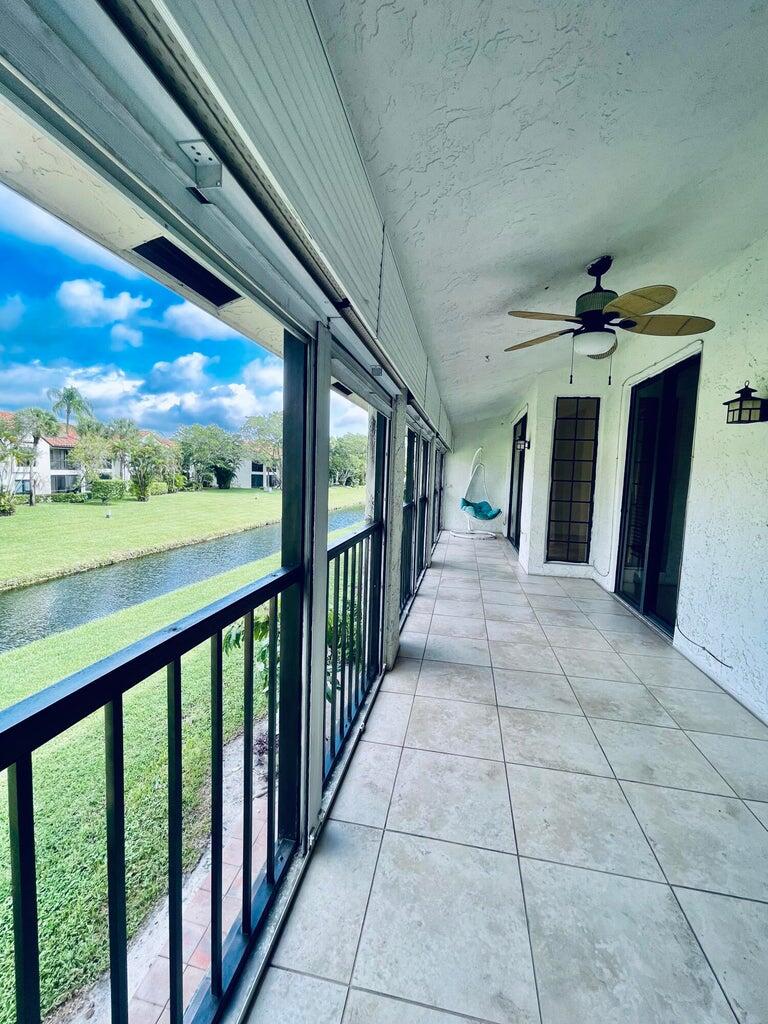 7888 La Mirada Drive Boca Raton, FL 33433 - Photo 25 of 29 a view of a porch and garden