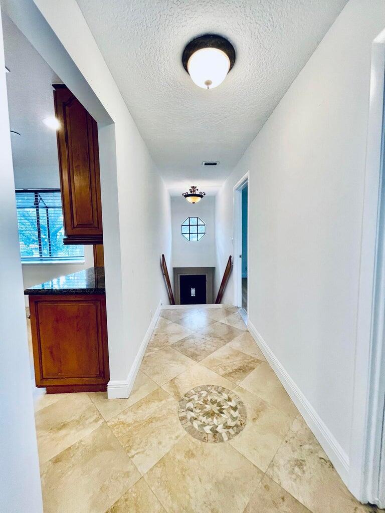 7888 La Mirada Drive Boca Raton, FL 33433 - Photo 3 of 29 a view of a kitchen with a sink and a bed