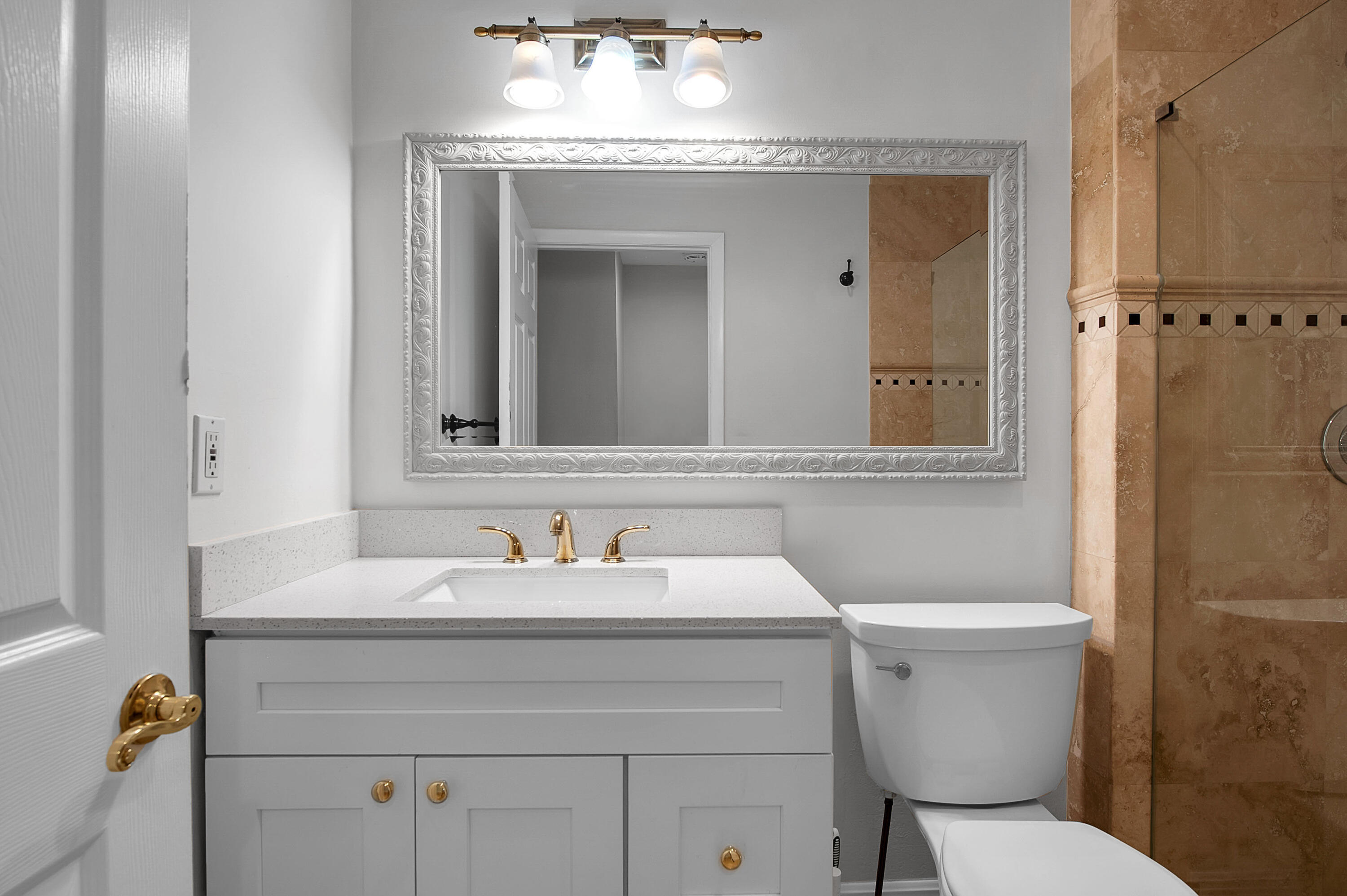 7888 La Mirada Drive Boca Raton, FL 33433 - Photo 37 of 61 a bathroom with a sink toilet and mirror