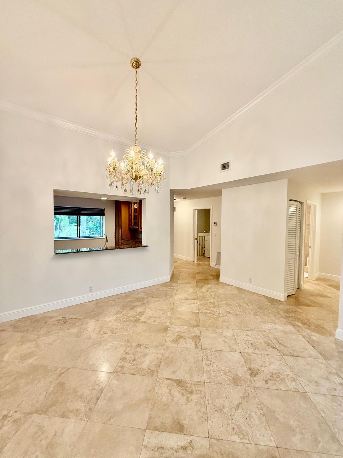 7888 La Mirada Drive Boca Raton, FL 33433 - Photo 6 of 29 a view of a room with a chandelier