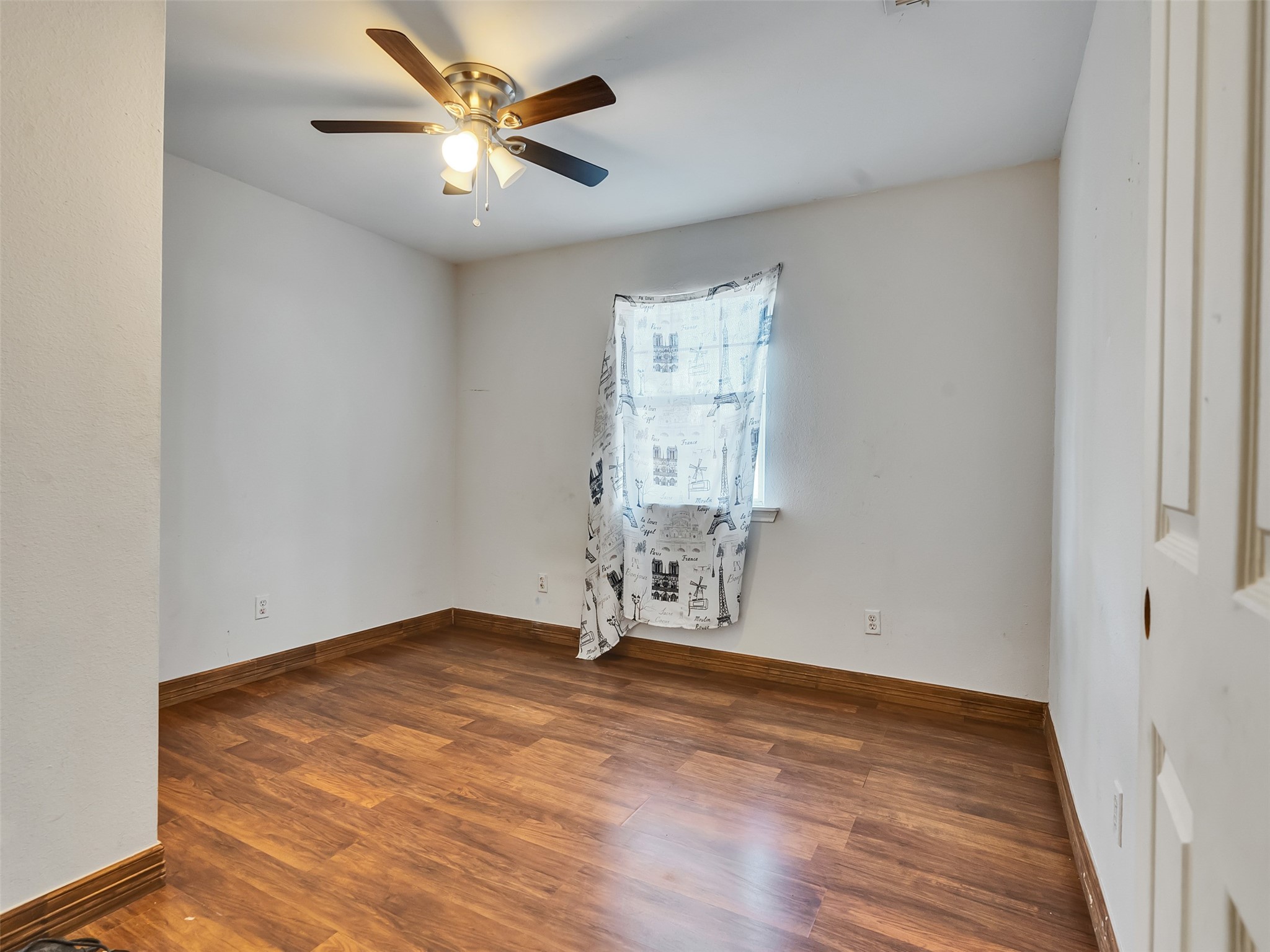 81 Hicks Cleveland, TX 77328 - Photo 14 of 24 an empty room with wooden floor and a window