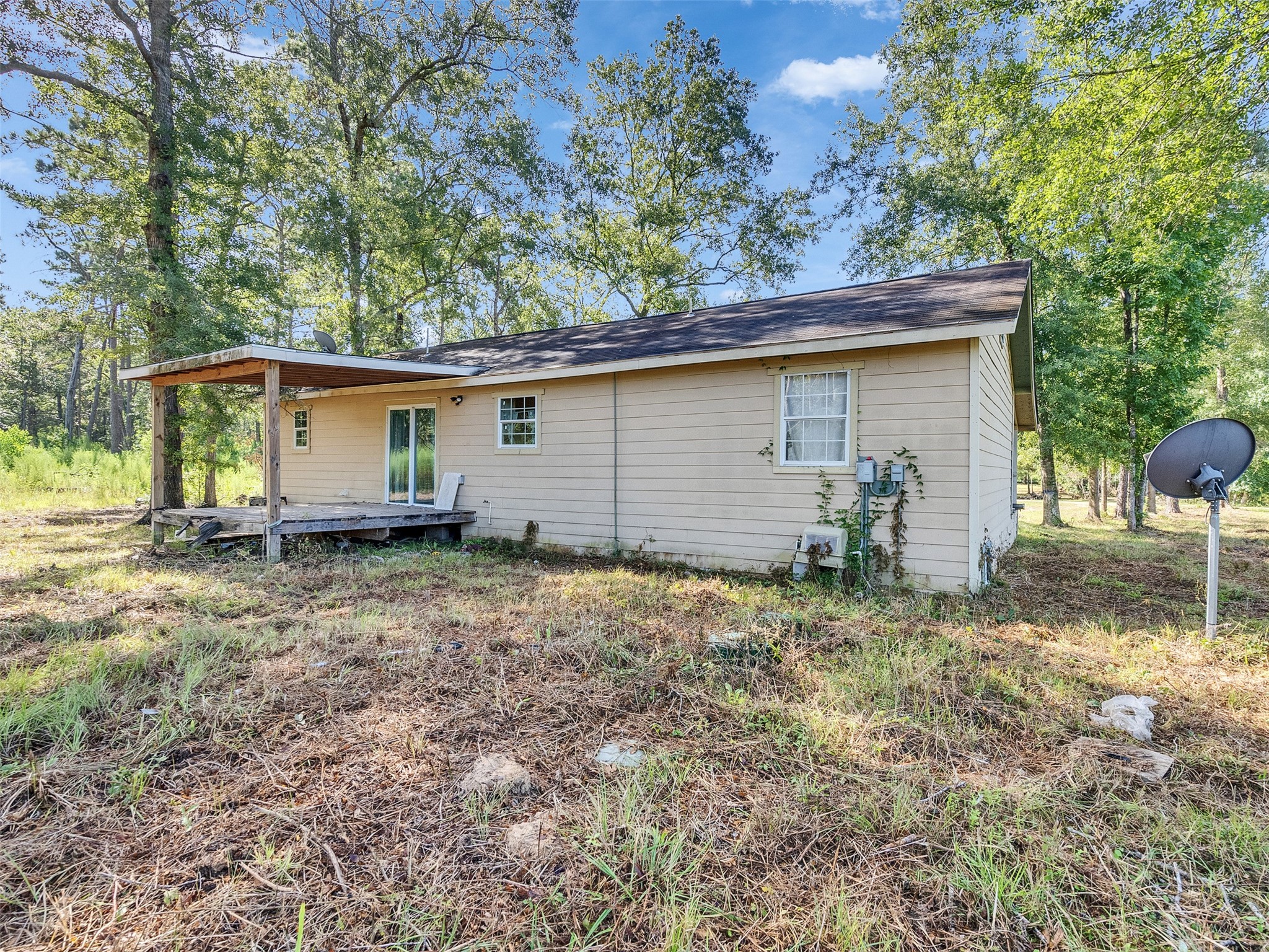 81 Hicks Cleveland, TX 77328 - Photo 16 of 24 a backyard of a house with plants and trees