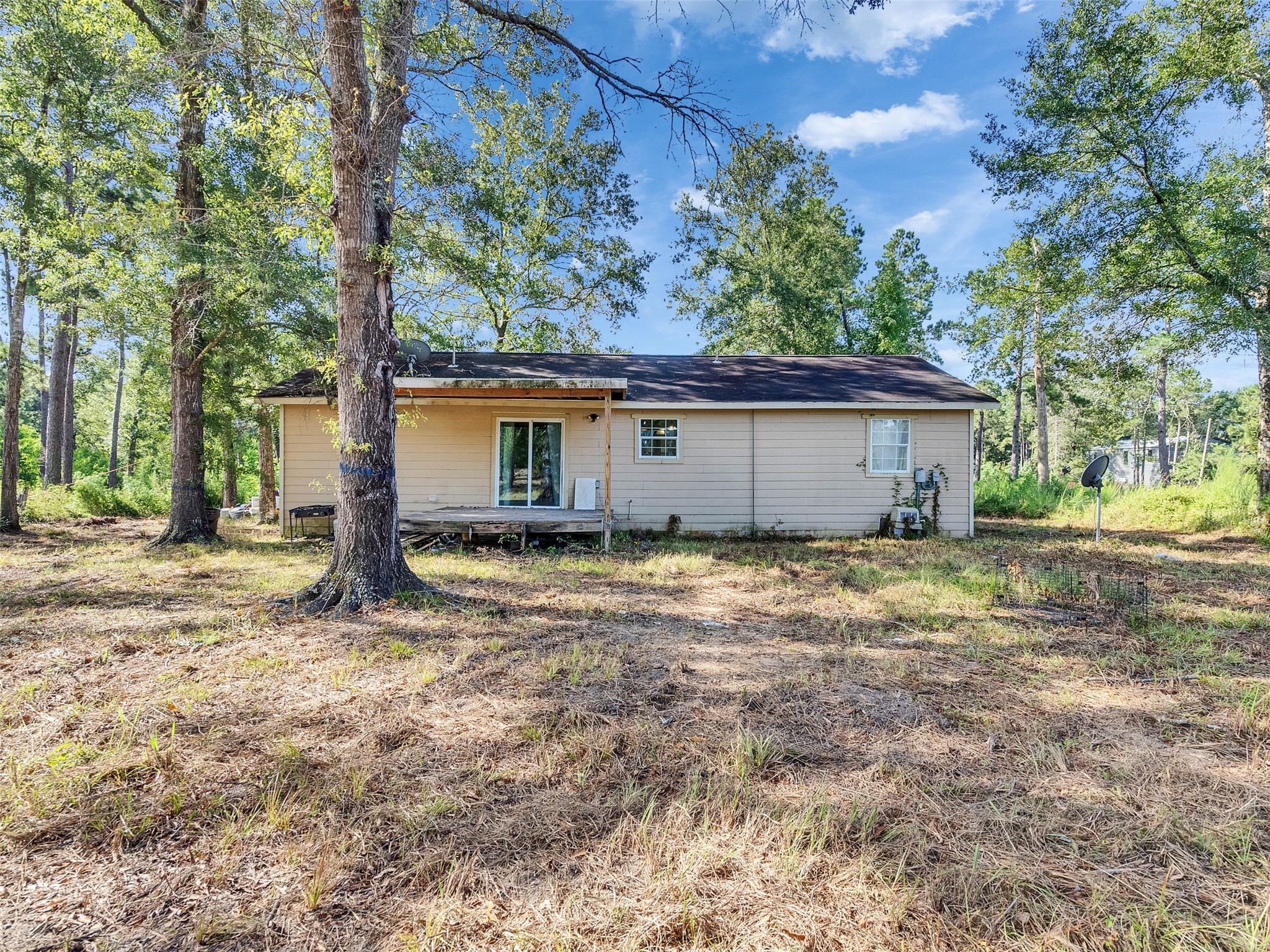81 Hicks Cleveland, TX 77328 - Photo 17 of 24 a view of a house with a yard