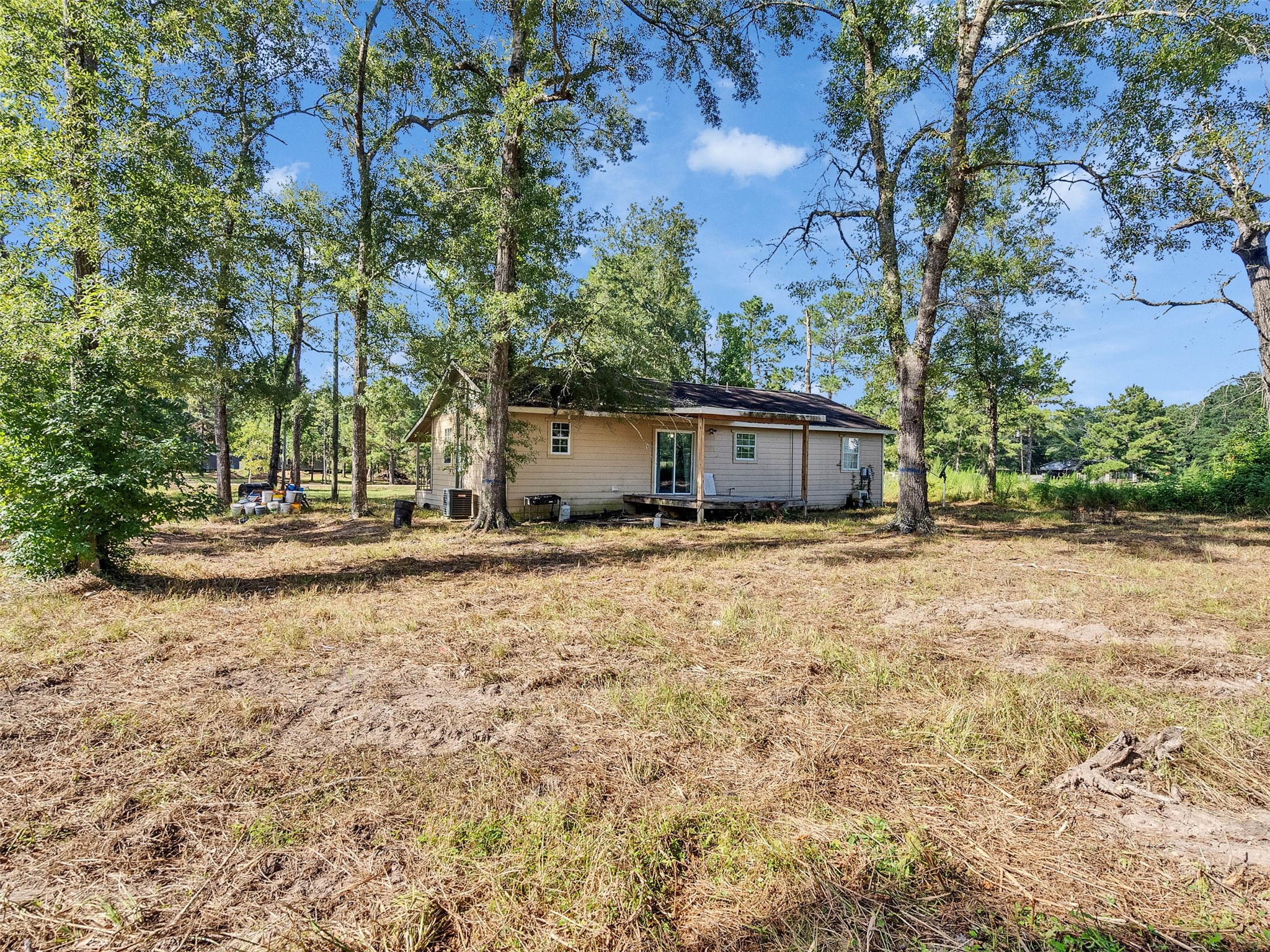 81 Hicks Cleveland, TX 77328 - Photo 18 of 24 a view of a house with backyard and tree