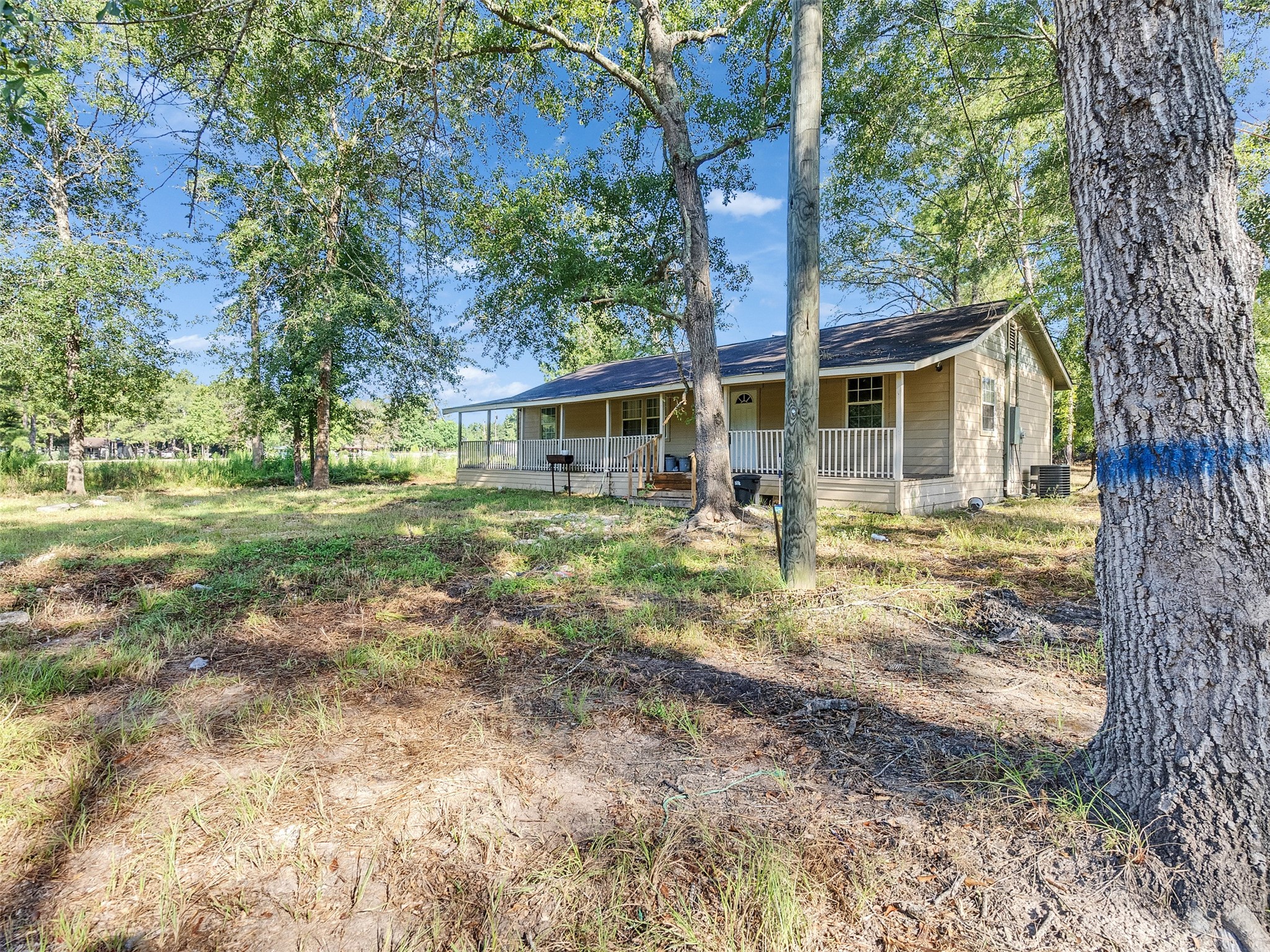 81 Hicks Cleveland, TX 77328 - Photo 2 of 24 a front view of a house with a yard