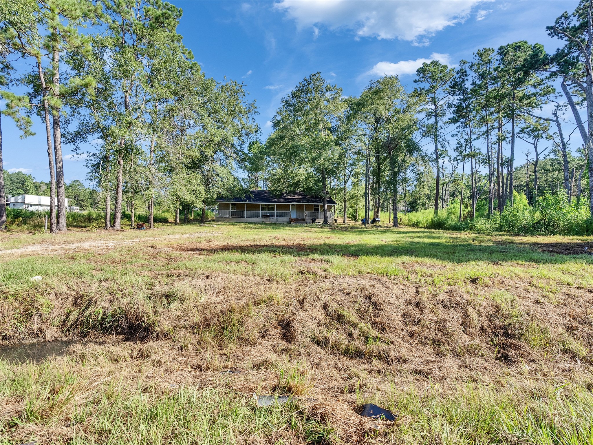 81 Hicks Cleveland, TX 77328 - Photo 3 of 24 a view of a golf course with a house