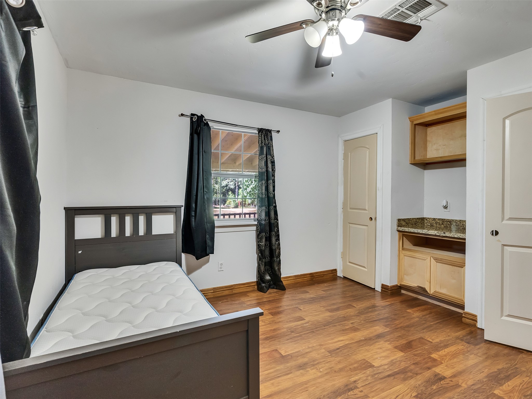 81 Hicks Cleveland, TX 77328 - Photo 7 of 24 a kitchen with stainless steel appliances granite countertop a stove a refrigerator and a microwave