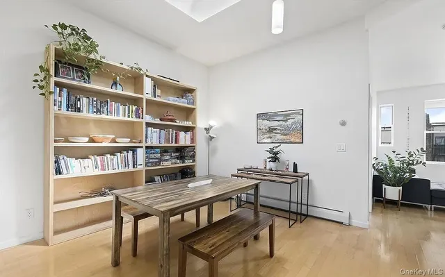 a reading room with furniture and a book shelf
