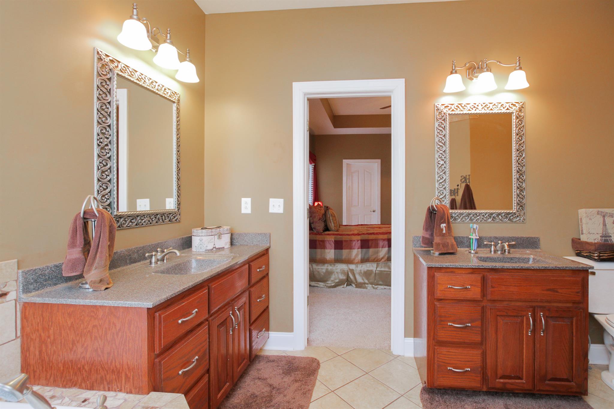 3463 Ott Wilson Road Springfield, TN 37172 - Photo 19 of 30 a bathroom with a sink double vanity and a mirror