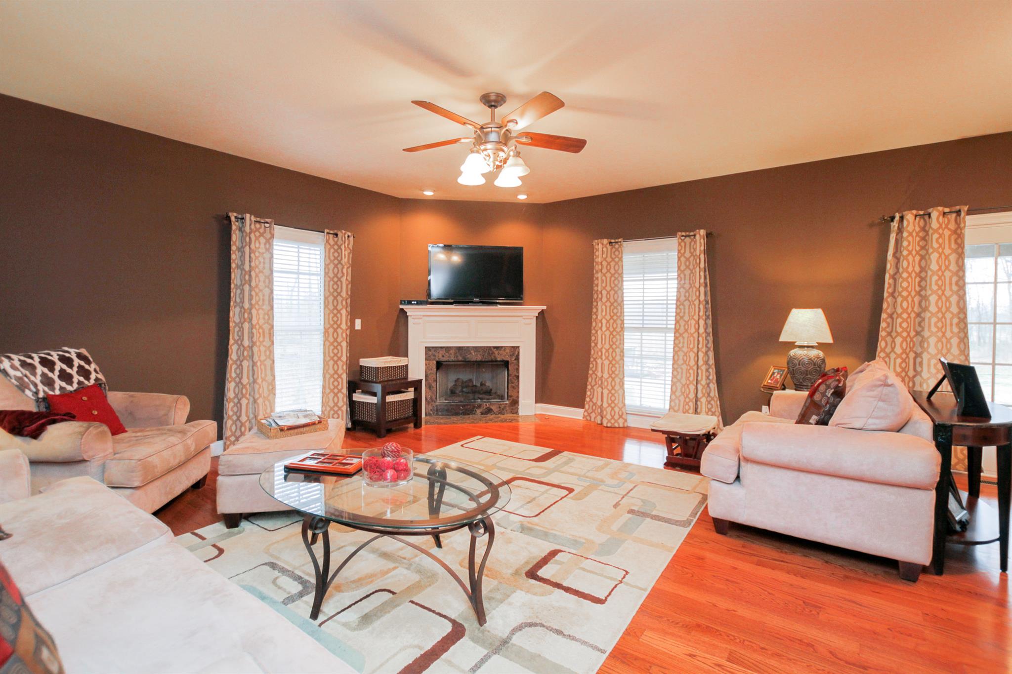 3463 Ott Wilson Road Springfield, TN 37172 - Photo 6 of 30 a bedroom with a bed and a chandelier