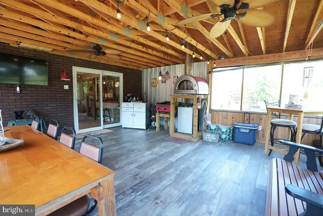 a view of a patio with table and chairs
