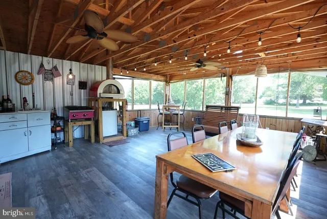 a view of a dining room with furniture window and outside view