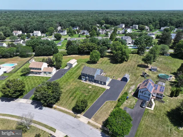 an aerial view of a house with a garden