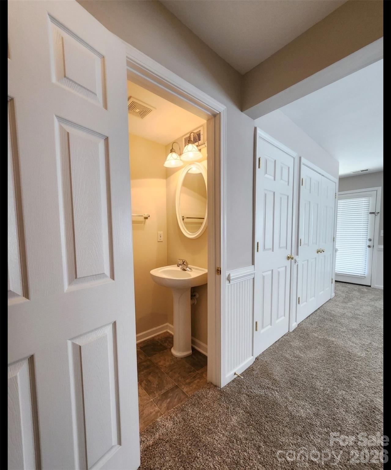 104 Rock Ridge Lane Mount Holly, NC 28120 - Photo 11 of 44 a view of a bathroom with a sink and a mirror