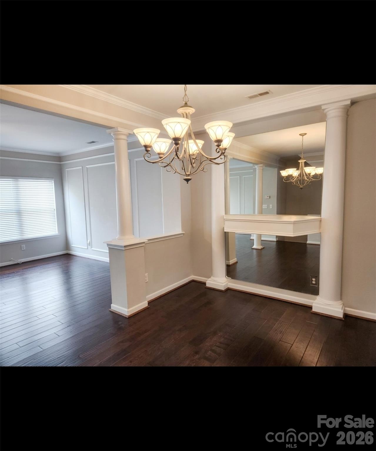 104 Rock Ridge Lane Mount Holly, NC 28120 - Photo 13 of 44 a view of a livingroom with wooden floor and a kitchen view