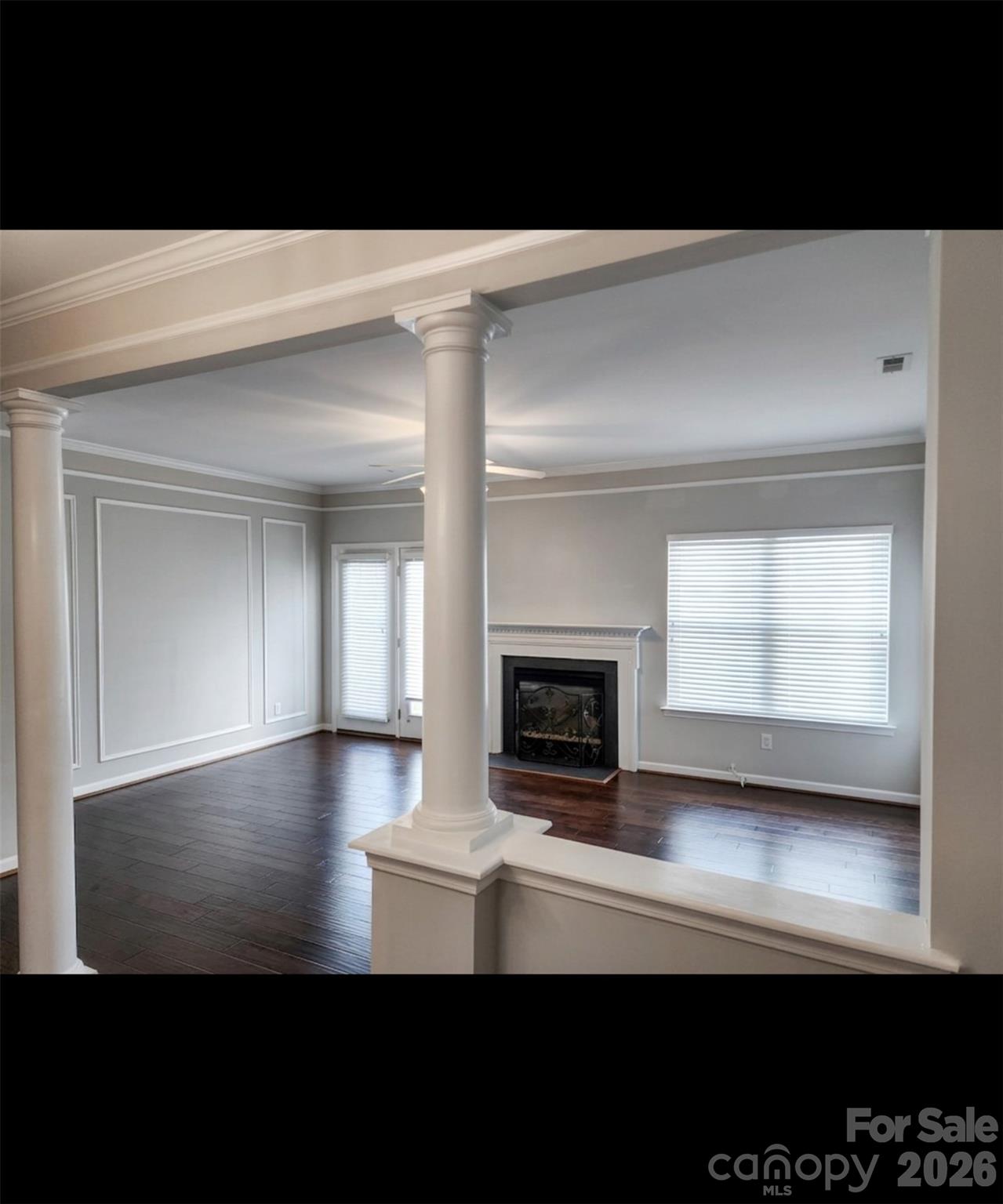 104 Rock Ridge Lane Mount Holly, NC 28120 - Photo 14 of 44 a view of an empty room with a fireplace and a window