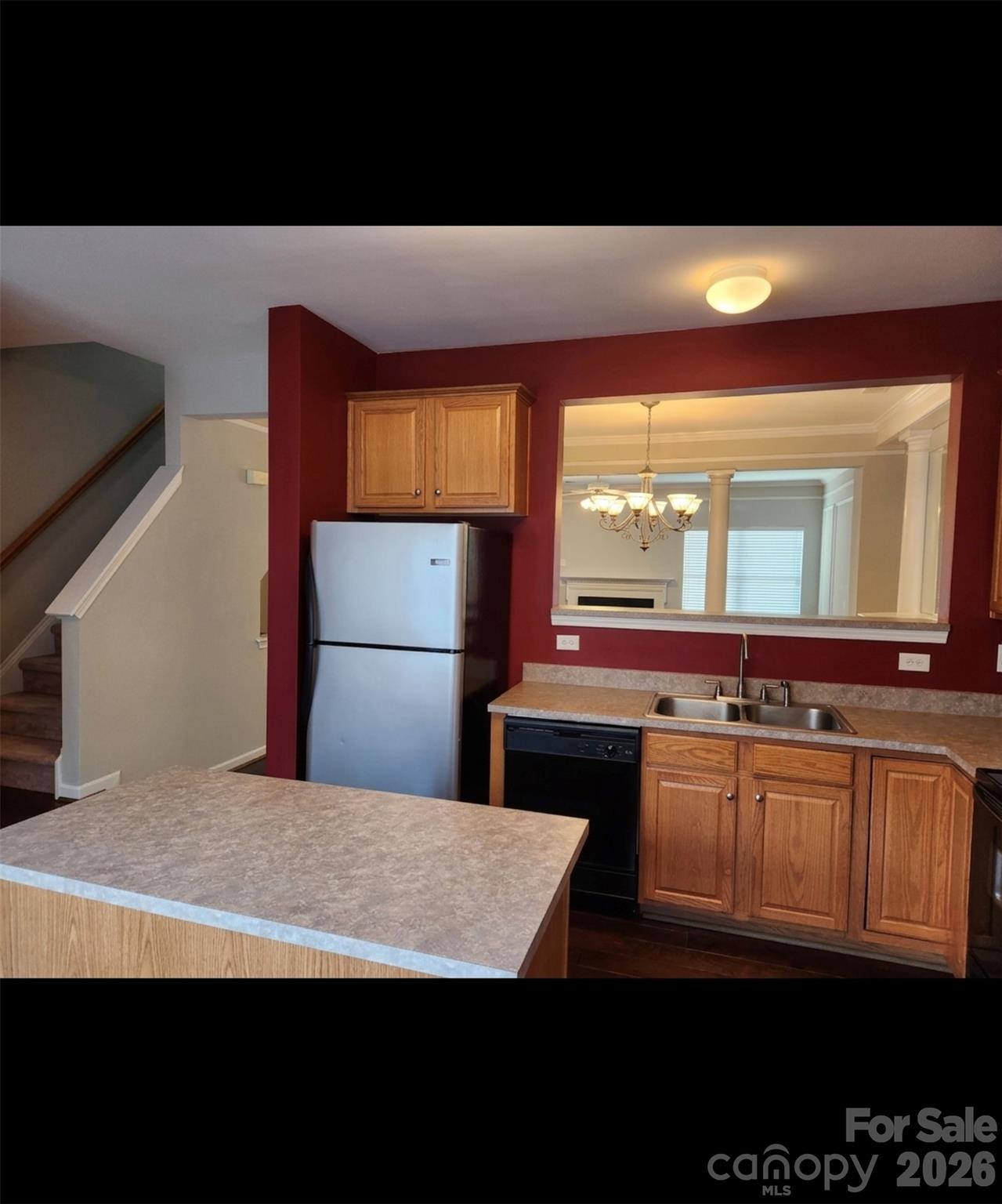 104 Rock Ridge Lane Mount Holly, NC 28120 - Photo 21 of 44 a kitchen with stainless steel appliances a sink stove and cabinets