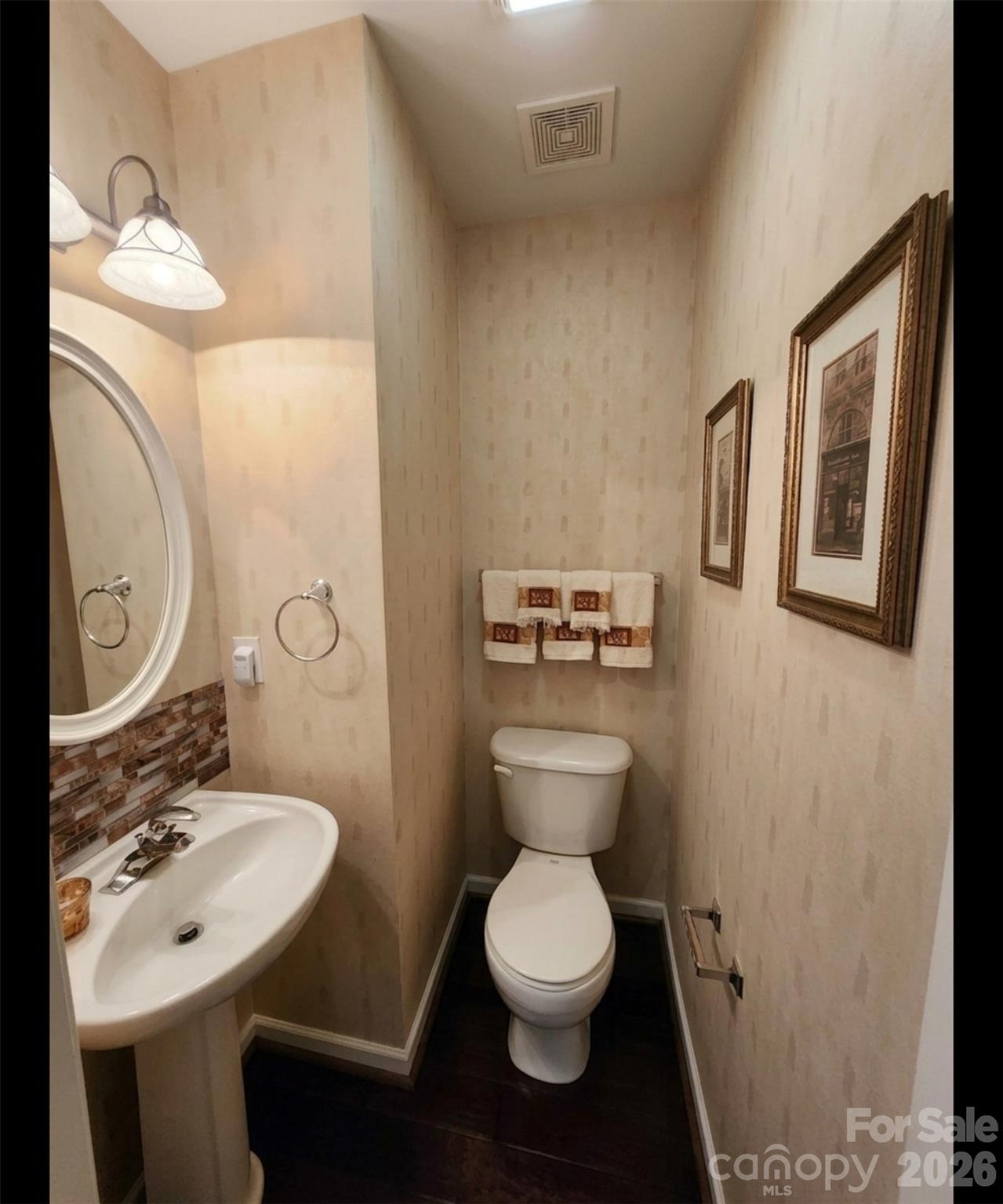 104 Rock Ridge Lane Mount Holly, NC 28120 - Photo 23 of 44 a bathroom with a toilet sink and mirror