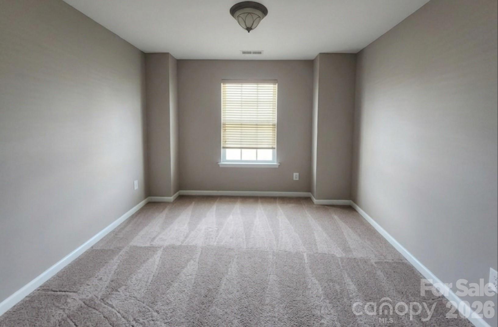 104 Rock Ridge Lane Mount Holly, NC 28120 - Photo 27 of 44 an empty room with a window