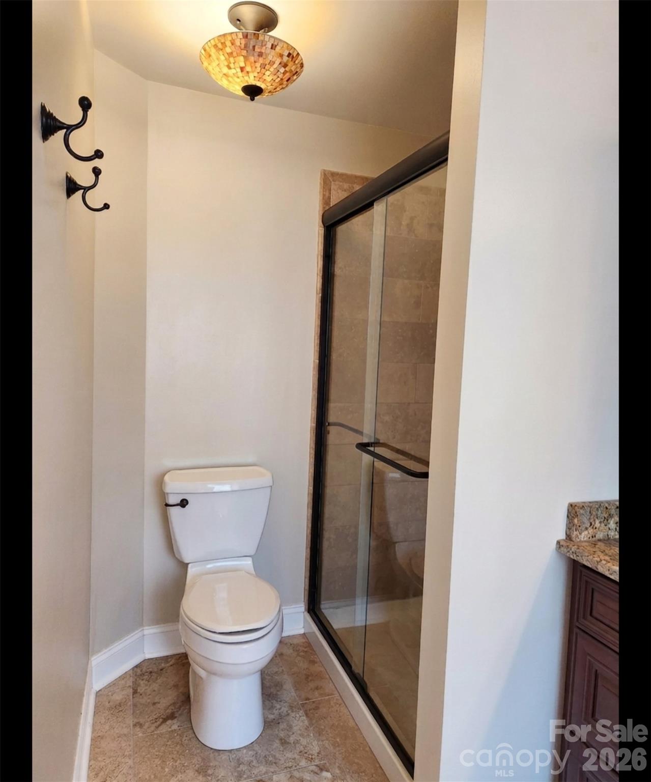 104 Rock Ridge Lane Mount Holly, NC 28120 - Photo 34 of 44 a bathroom with a toilet and a shower