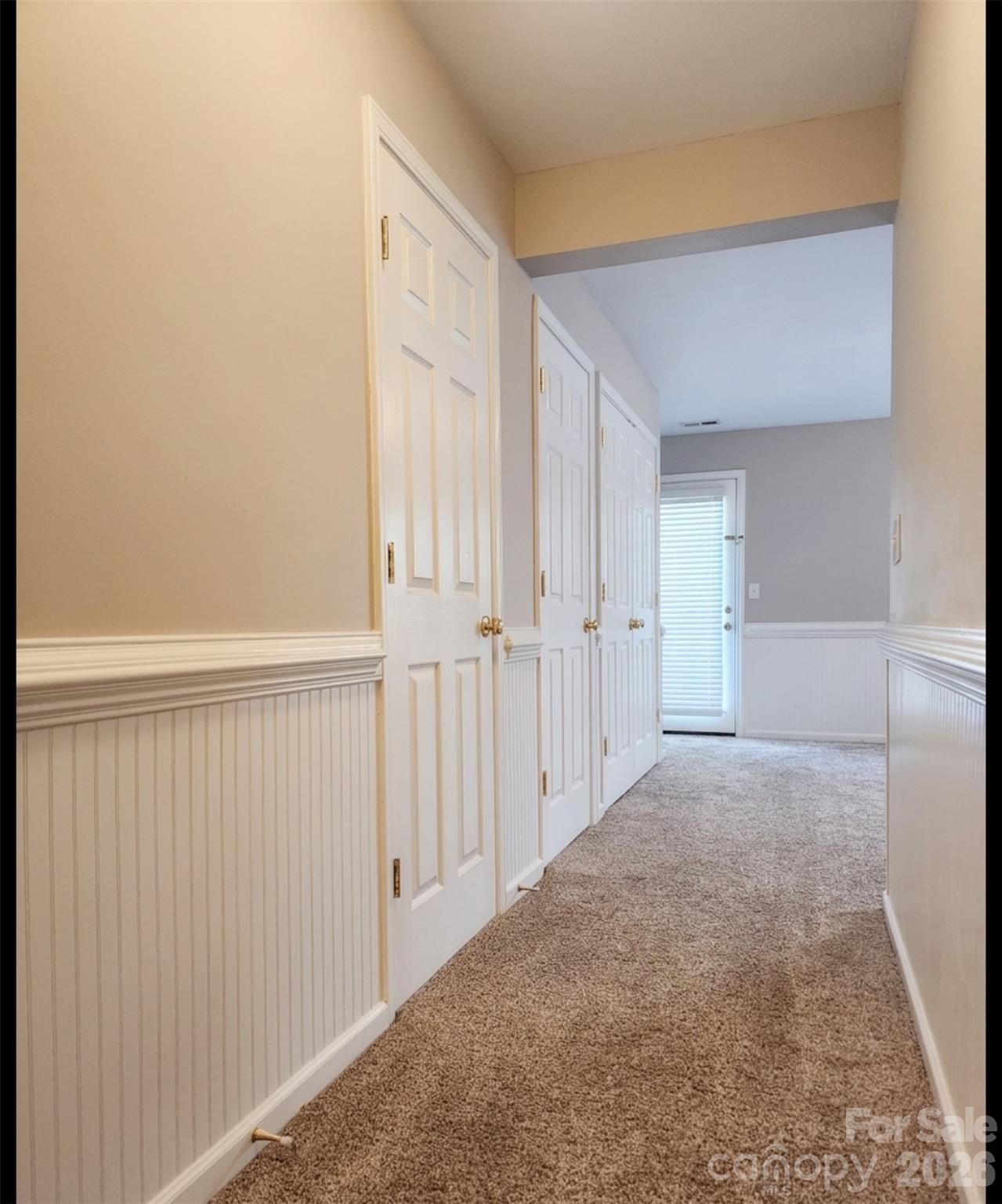 104 Rock Ridge Lane Mount Holly, NC 28120 - Photo 4 of 44 a view of a hallway with wooden floor