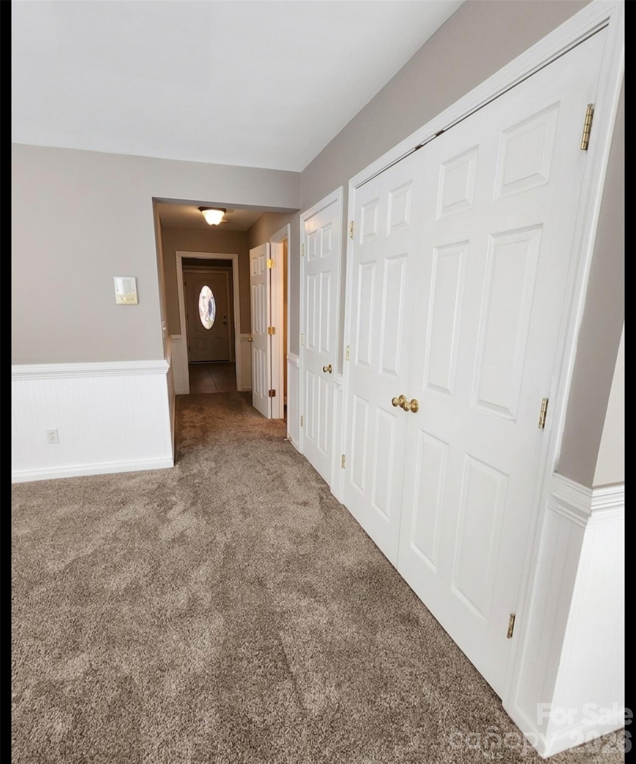 104 Rock Ridge Lane Mount Holly, NC 28120 - Photo 8 of 44 a view of a livingroom with an empty space and wooden floor