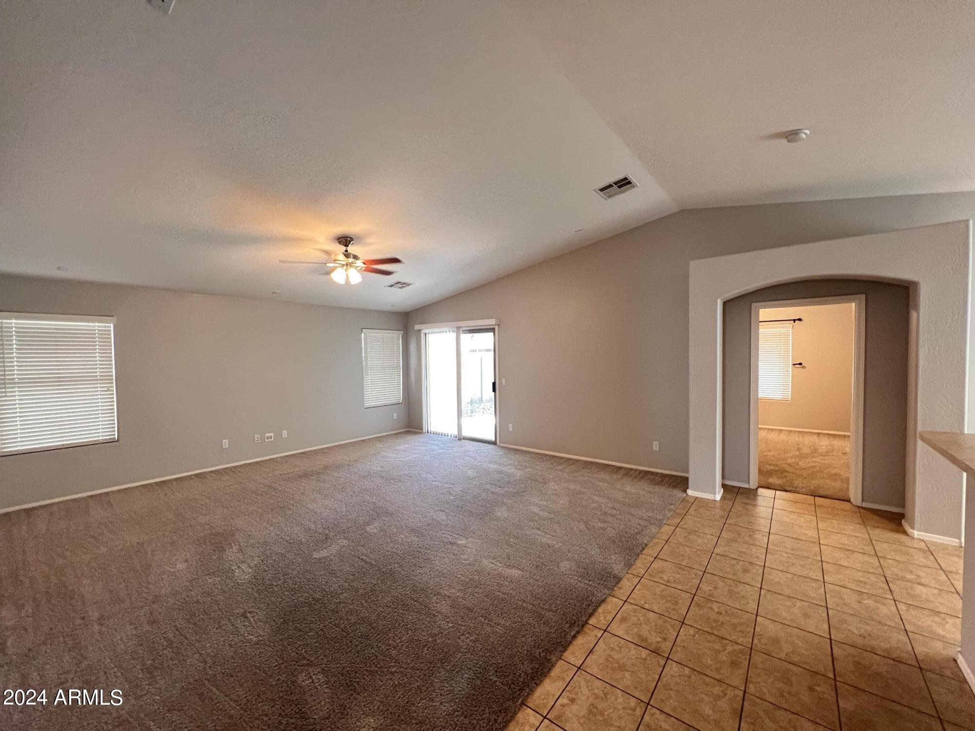 3797 East Ironhorse Road Gilbert, AZ 85297 - Photo 11 of 22 a view of an empty room with window and chandelier fan