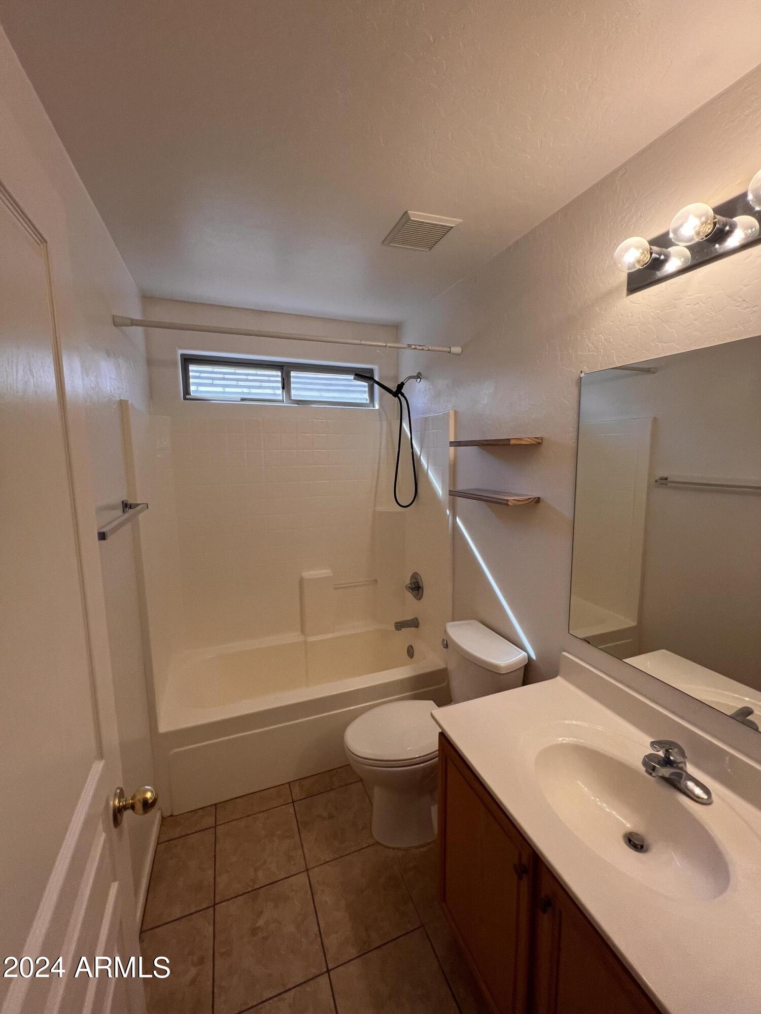 3797 East Ironhorse Road Gilbert, AZ 85297 - Photo 14 of 22 a bathroom with a sink a toilet and shower