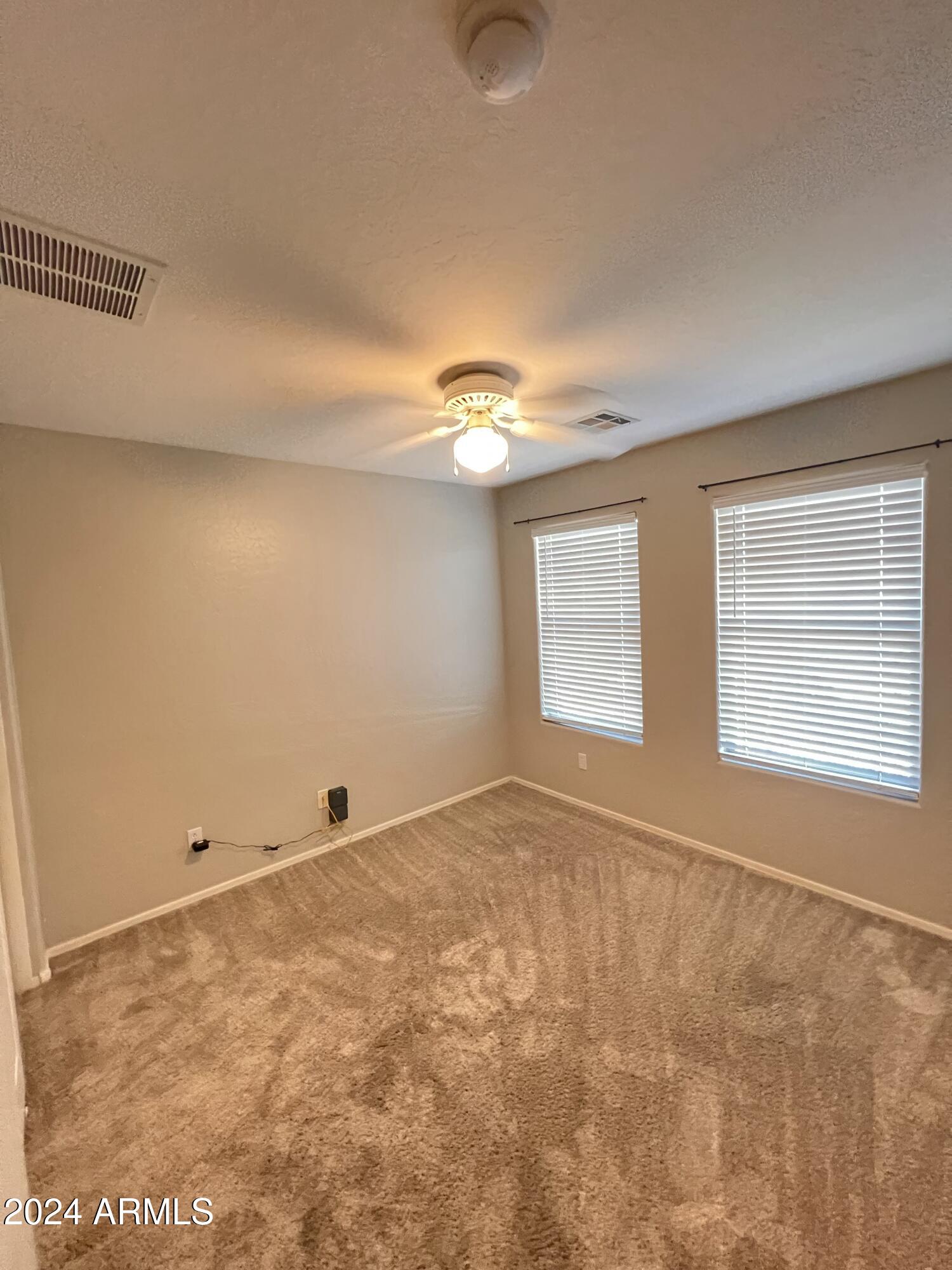 3797 East Ironhorse Road Gilbert, AZ 85297 - Photo 16 of 22 a view of an empty room with a window