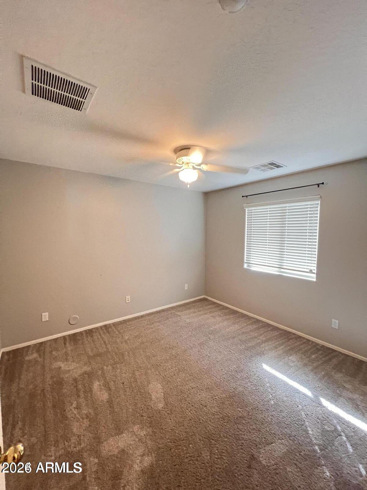 3797 East Ironhorse Road Gilbert, AZ 85297 - Photo 20 of 22 a view of an empty room with a window
