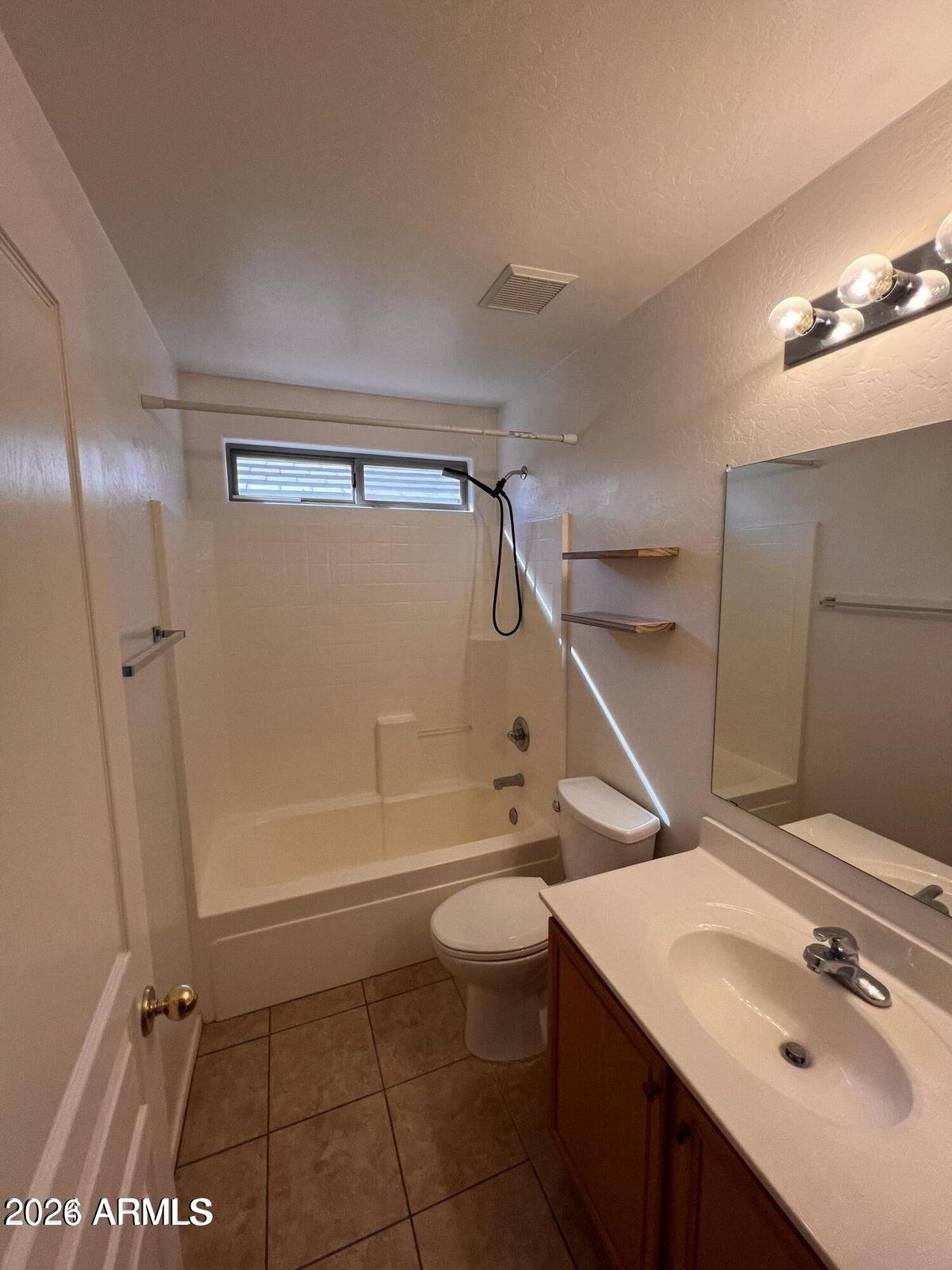 3797 East Ironhorse Road Gilbert, AZ 85297 - Photo 21 of 22 a bathroom with a sink a toilet and shower