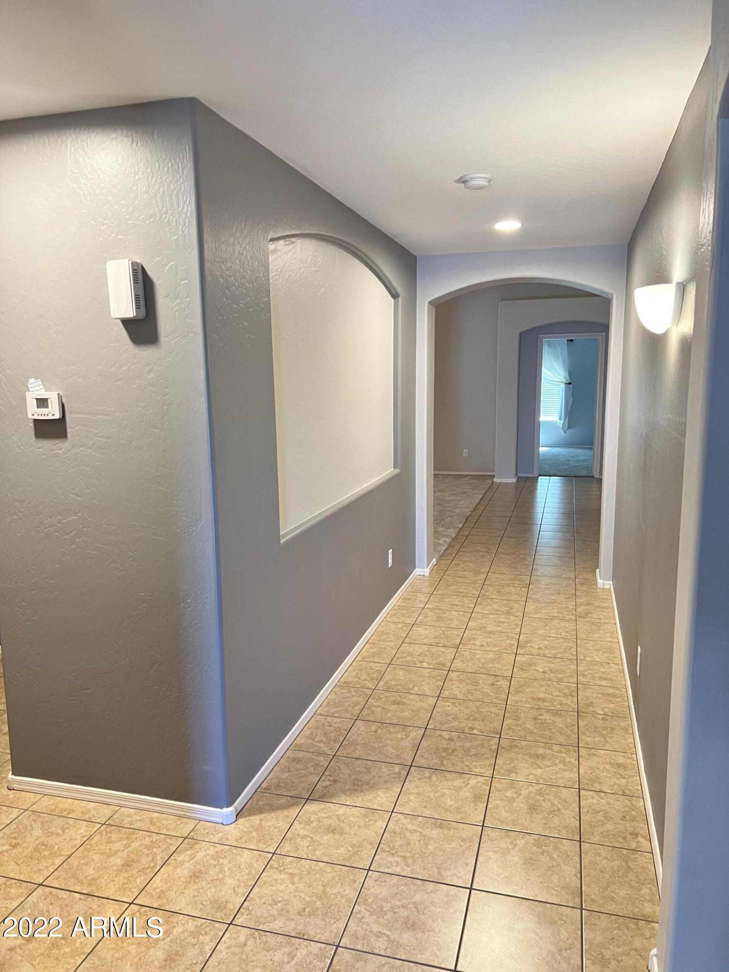 3797 East Ironhorse Road Gilbert, AZ 85297 - Photo 4 of 22 a view of hallway with natural light