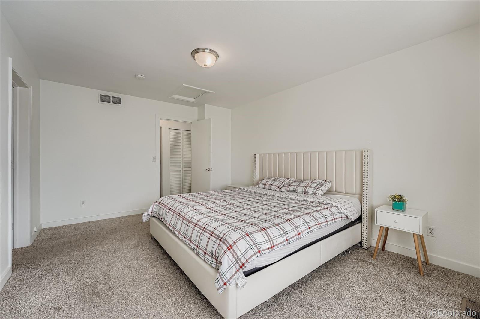 4250 Perth Circle Denver, CO 80249 - Photo 16 of 31 a bedroom with a bed and a window