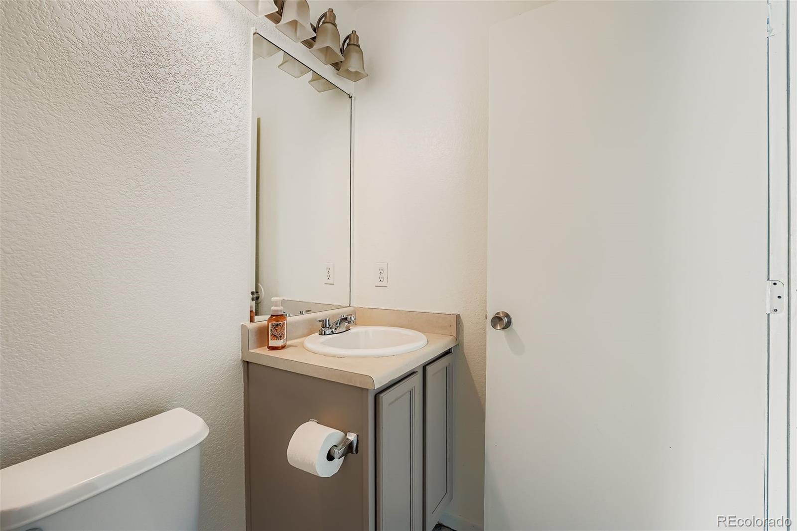 4250 Perth Circle Denver, CO 80249 - Photo 18 of 31 a bathroom with a sink and a toilet
