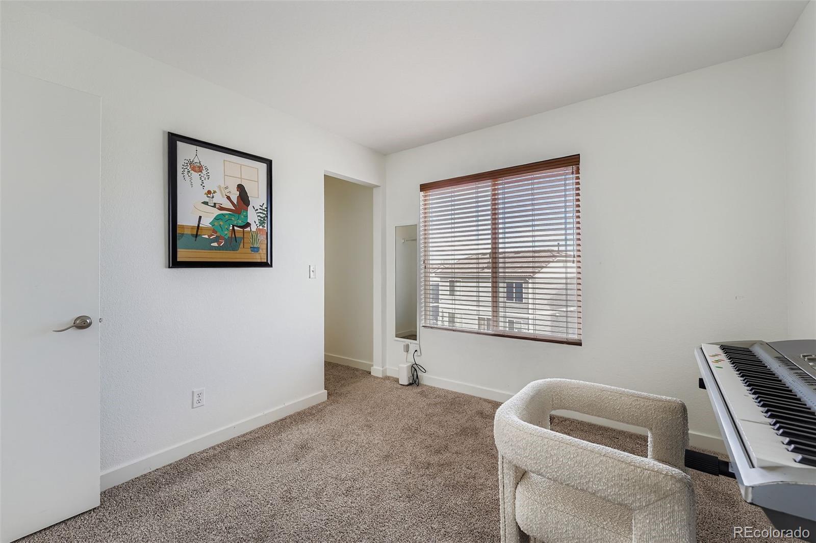 4250 Perth Circle Denver, CO 80249 - Photo 22 of 31 a living room with furniture and a window