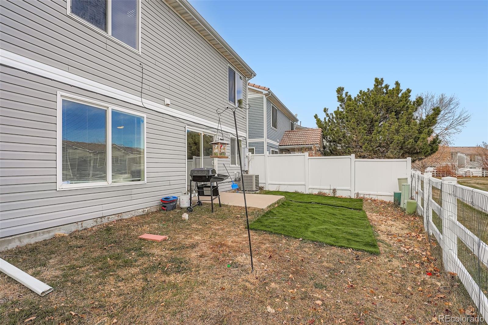 4250 Perth Circle Denver, CO 80249 - Photo 28 of 31 a view of a house with a yard and sitting area