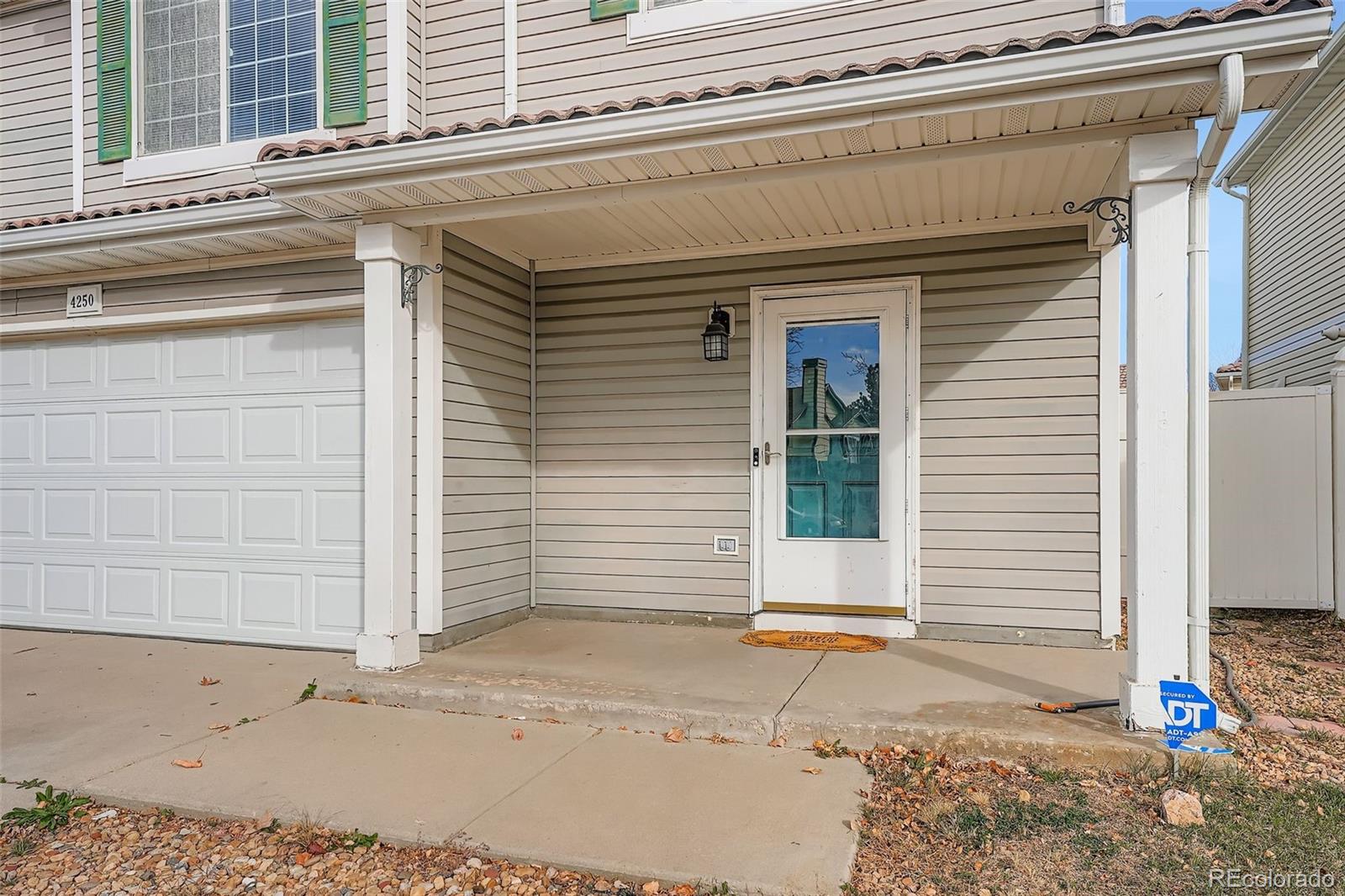 4250 Perth Circle Denver, CO 80249 - Photo 3 of 31 a front view of a house