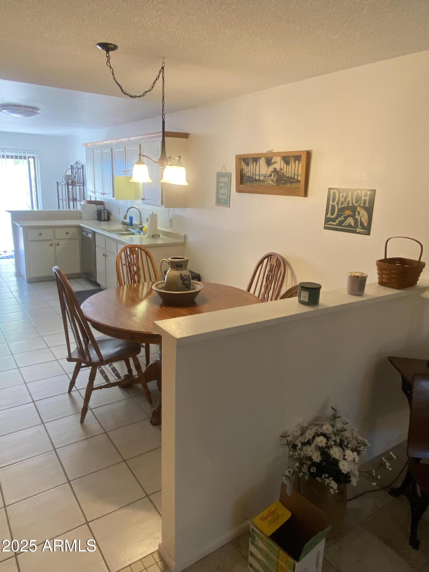 455 South Delaware Drive, Unit 171 Apache Junction, AZ 85120 - Photo 7 of 20 a kitchen with a sink cabinets and window