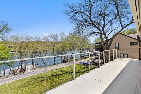 a view of a lake with couches deck