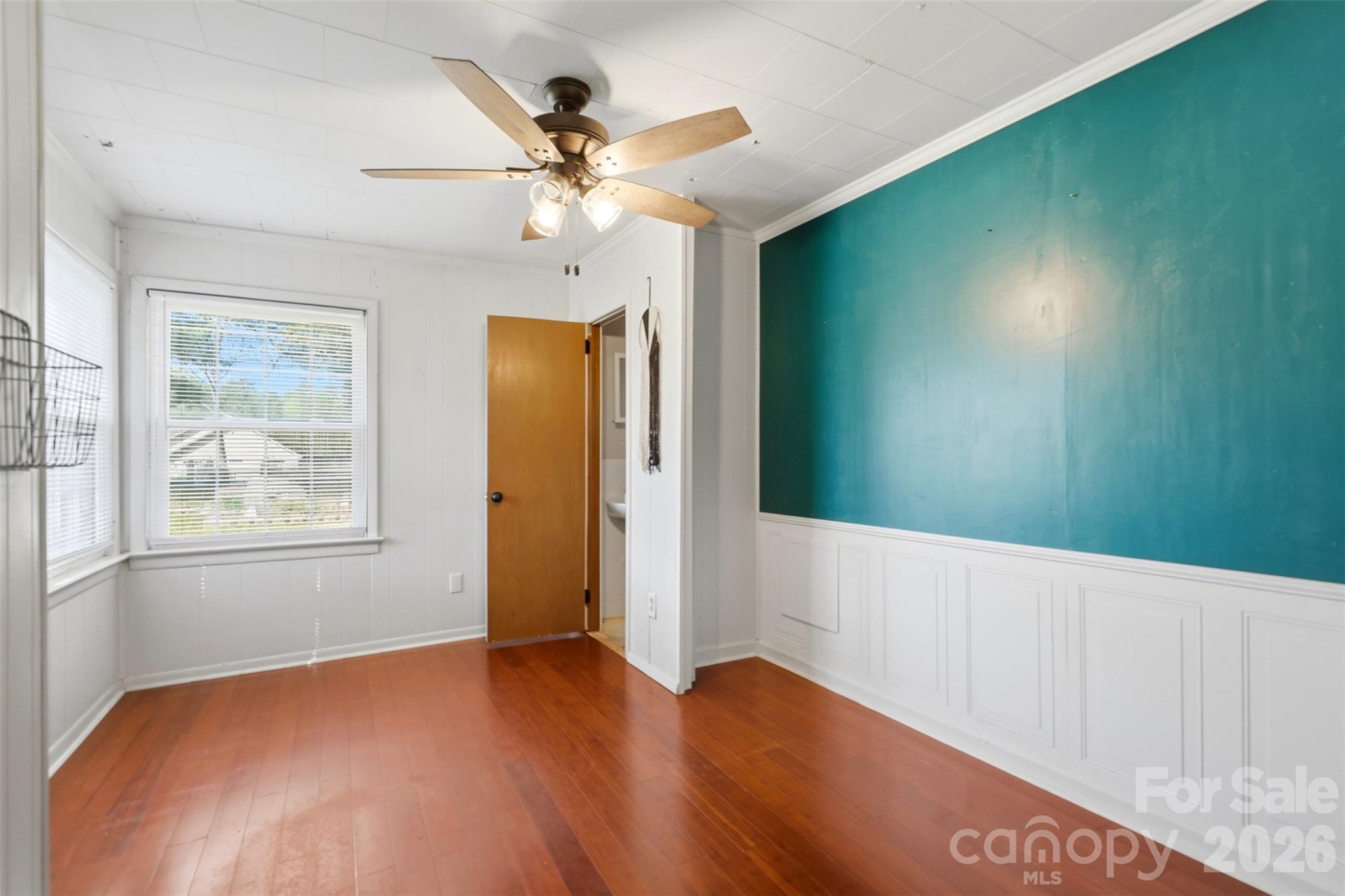 2670 North Olivers Road Newton, NC 28658 - Photo 16 of 27 an empty room with windows and fan