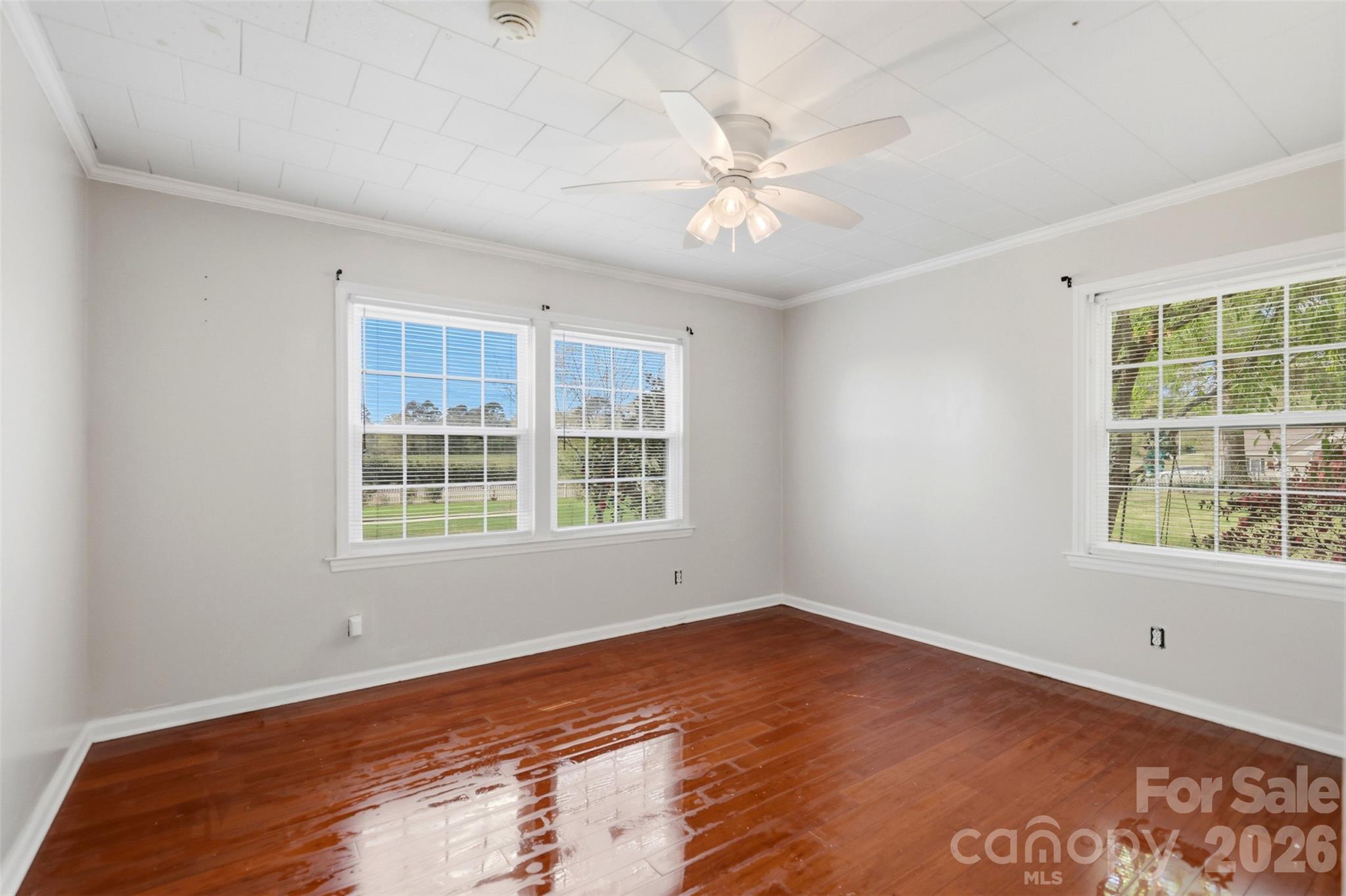 2670 North Olivers Road Newton, NC 28658 - Photo 17 of 27 a view of an empty room with wooden floor and a window